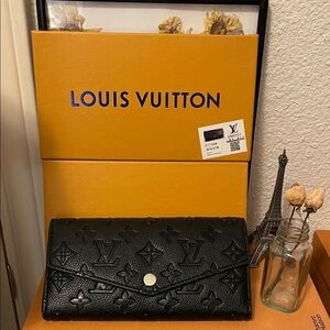 Black Monogramd Empreinte Flap Wallet. Closet clearout no returns. New in box .